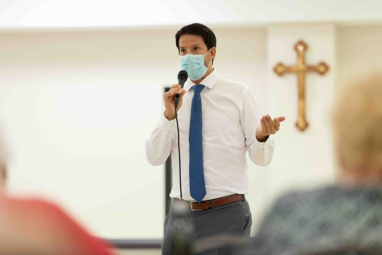 Former Councilman Mario Bravo (D1) speaks with residents during the Shearer Hills / Ridgeview Neighborhood Association meeting during the topic of the newly opened Migrant Resource Center off of San Pedro Avenue last July. 