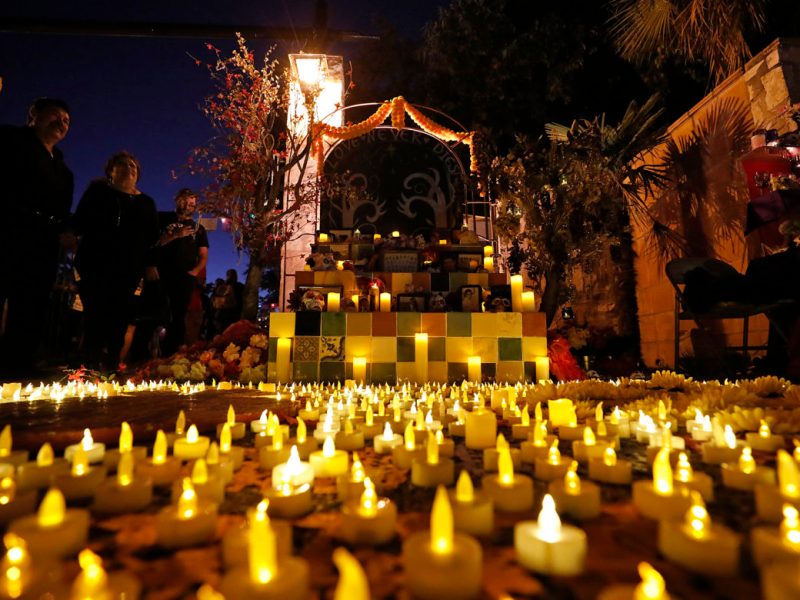 A family altar surrounded by illumination is displayed during the Dia de Los Muertos held at La Villita in 2018.