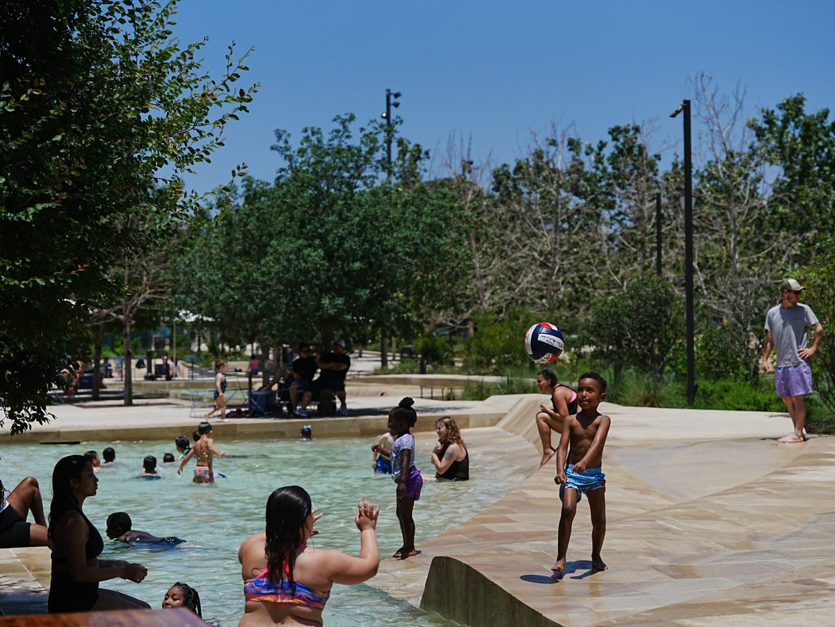 Children play in the splash pads at Civic Park.