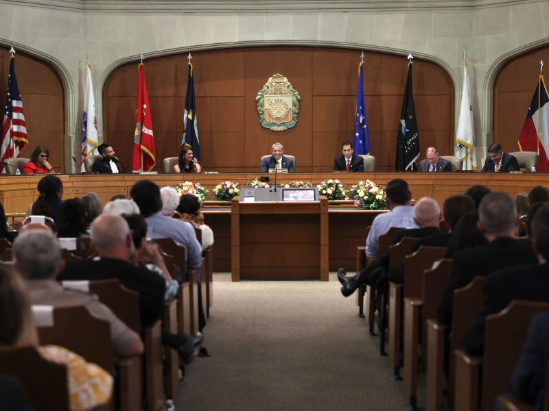 The newly assembled City Council representatives take their seats at the dais during a commemorative ceremony on Wednesday evening.