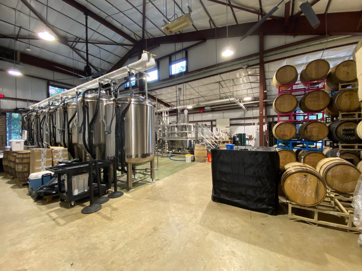 On the left large tanks are busy brewing Vista's beer, and on the right old wine barrels wait to infuse the brews with remnants of it's previous tenant.