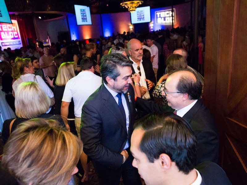 Councilman Roberto Treviño (D1) speaks with San Antonio Hispanic Chamber of Commerce President and CEO Ramiro Cavasos before the event begins. Photo by Michael Cirlos.