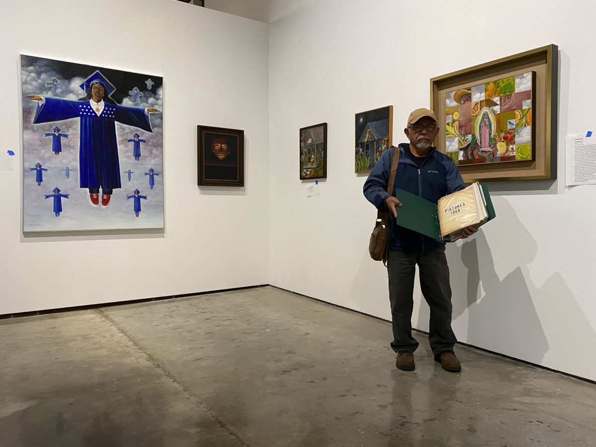 Artist José Esquivel shows an archive of the Con Safo group's founding documents among his artworks on display at Centro de Artes in 2020.