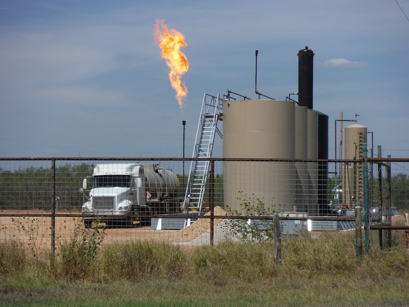 A facility with a large methane flare in the Eagle Ford Shale region. Photo by Mario Bravo.