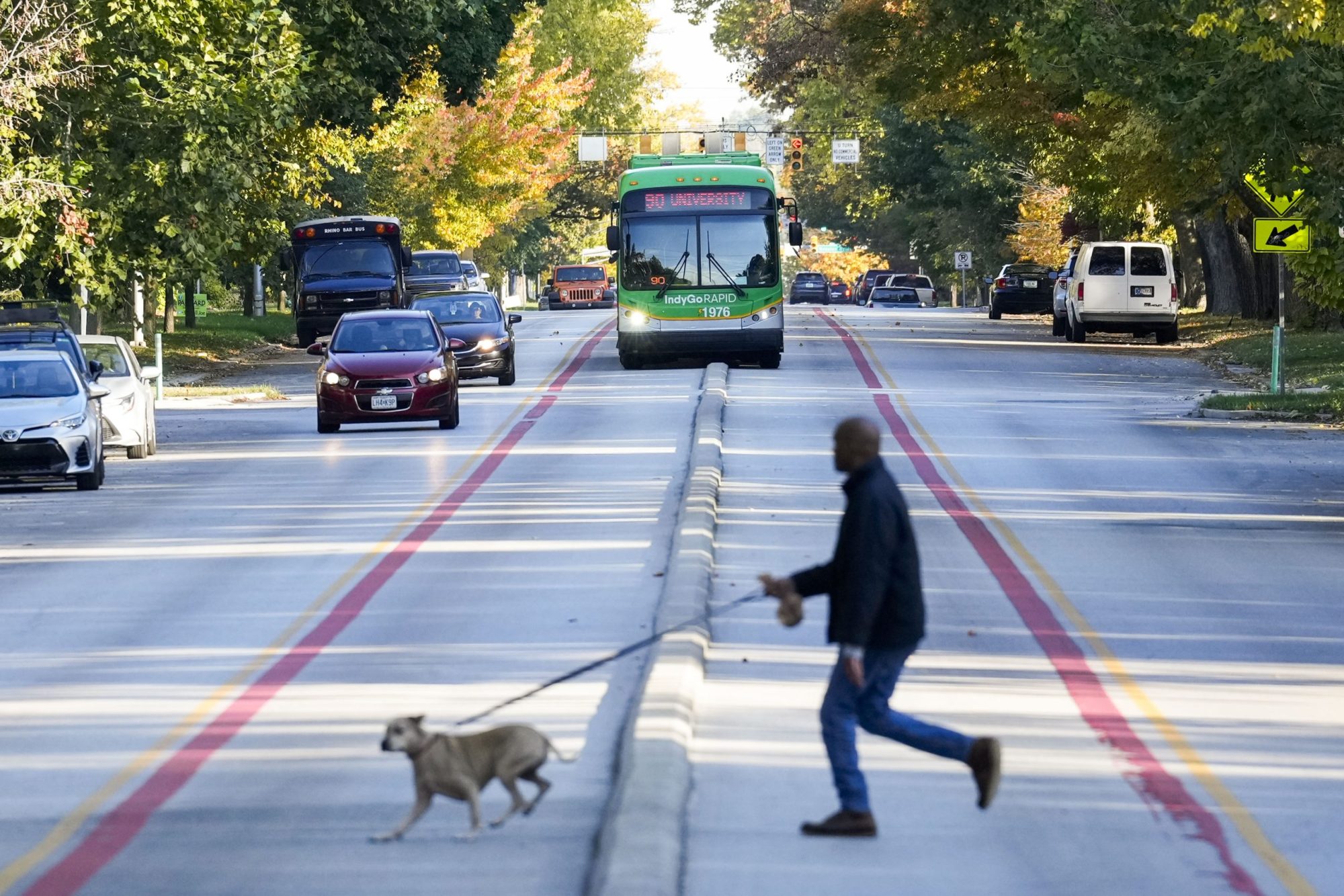 An IndyGo bus in Indianapolis travels in a dedicated lane for both northbound and southbound buses.