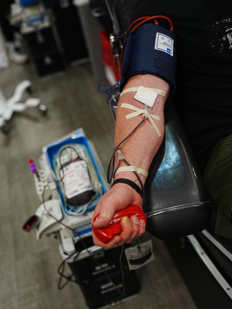 Josh Crumley donates blood at South Texas Blood and Tissue.