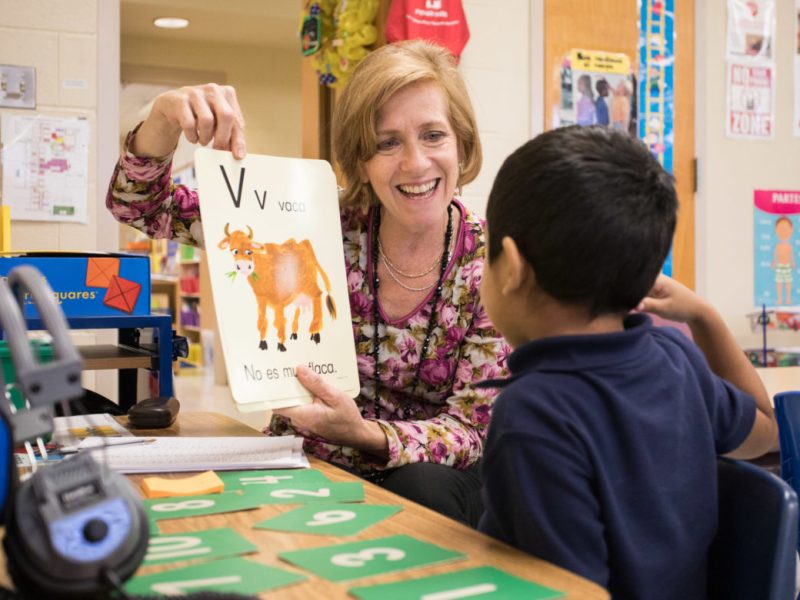 Carvajal Early Childhood Education Center teacher Andrea Greimel tests her children on their ability to identify letters.