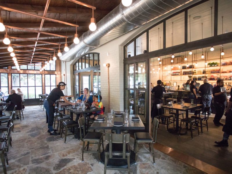 Inside Dough Pizzeria Napoletana at Hemisfair, customers can sit on a patio overlooking Yanaguana Garden.