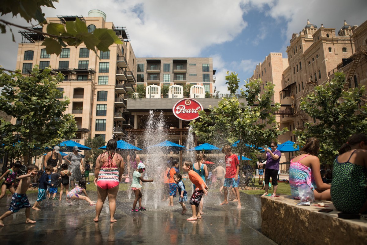 Children play in the fountains at the Pearl.