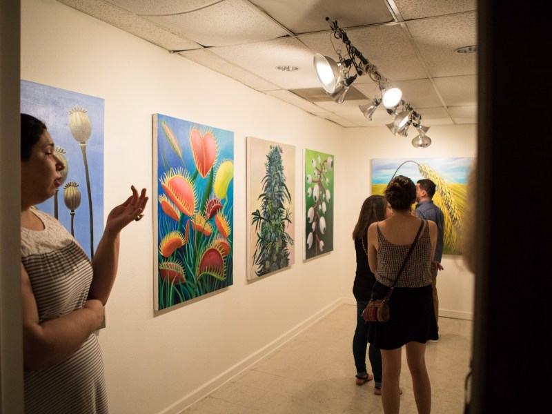 Crowds of people wander the galleries inside 1906 Studio on Second Saturday.