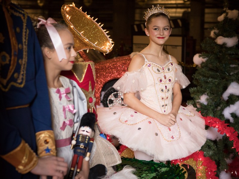 Madeleine Burroughs, 13, a dancer in the Alamo City Dance Company, stands on the Nutcracker barge in preparation for the Ford Holiday River Parade.