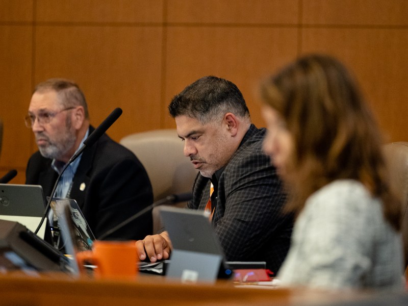 District 8 councilmember Manny Pelaez (center) and Councilman John Courage (D9), seen here during a May city council meeting, are the first to suggest that the city sues the state over House Bill 2127.