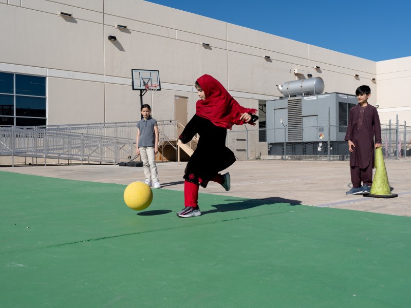 Compass Rose Dream students play kickball during Physical Education class on Tuesday.