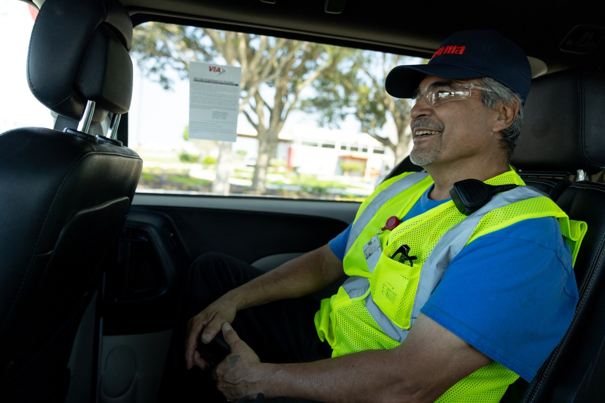 Eladio Diaz rides a VIA Link vehicle to ride to his job with Toyota supplier Forma Automotive.