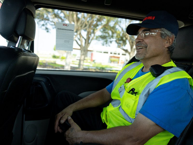 Eladio Diaz rides a VIA Link vehicle to ride to his job with Toyota supplier Forma Automotive.