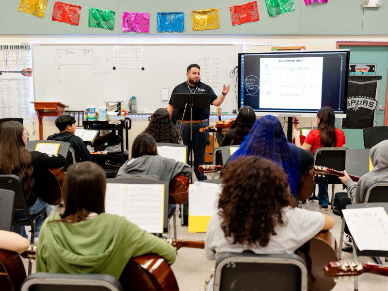 Poe Middle School mariachi teacher Augustine Ortiz leads students to play a D major scale.