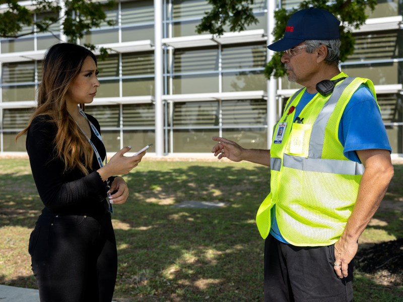 San Antonio Report Breaking News Reporter Raquel Torres interviews a Toyota Forma Automotive employee.