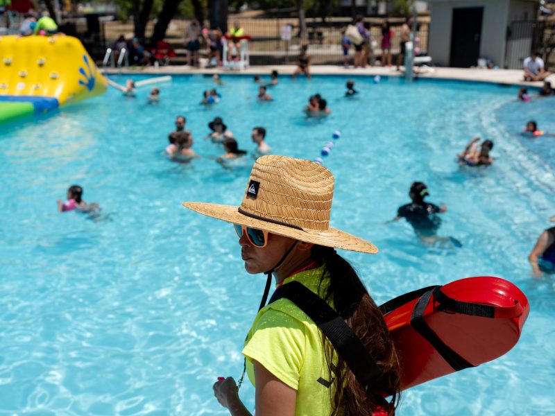 A life guard patrols the swimming pool at Roosevelt Park last summer.