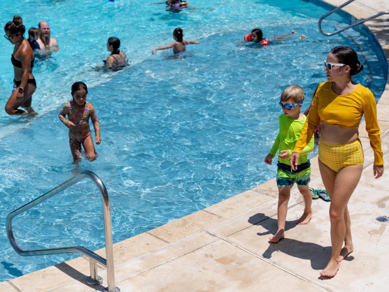 Families cool off at the Roosevelt Park swimming pool on Saturday afternoon.