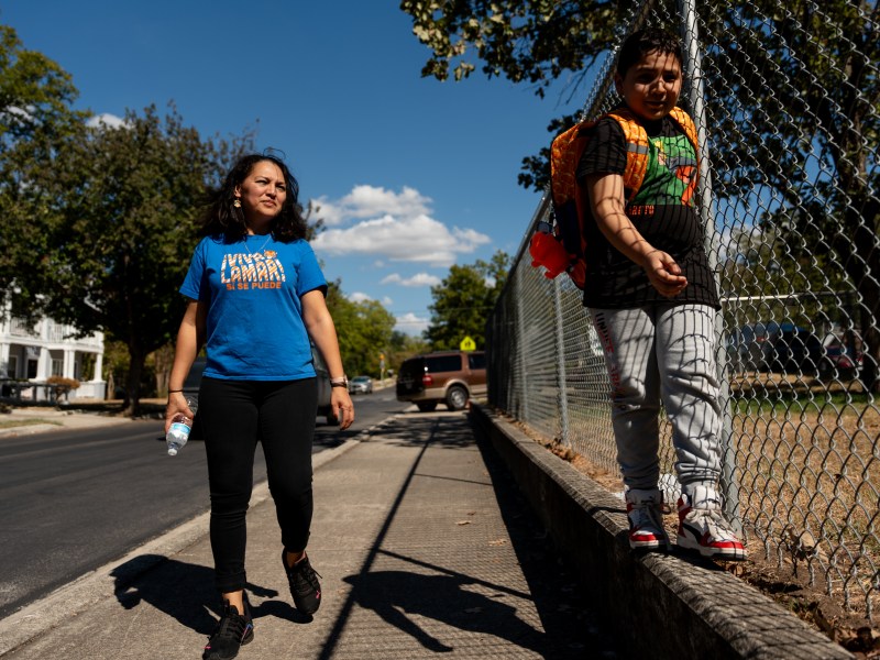 Ten-year-old Mateo Lopez (right) and his mother, Julia Hernandez, walk home from Lamar Elementary School.