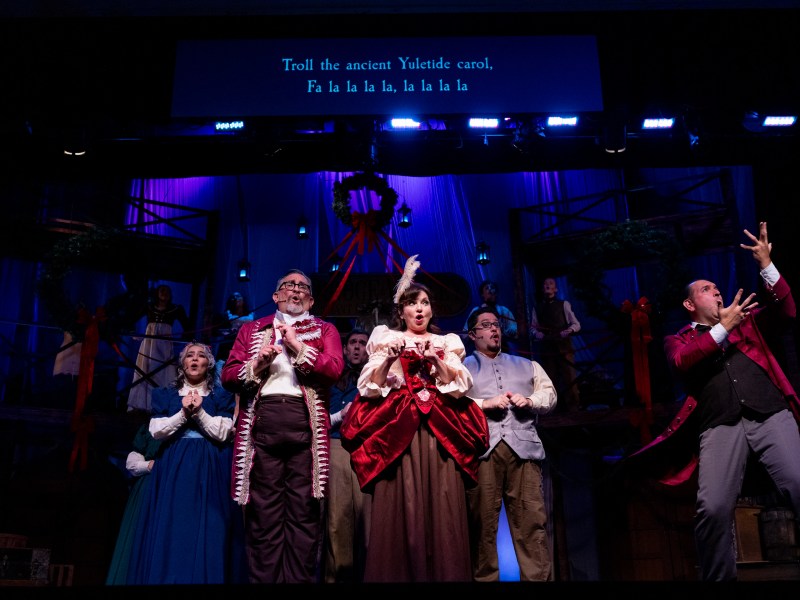 San Antonio Public Theatre actors in a sensory friendly adaptation of Charles Dickens' A Christmas Carol speak their lines in a combination of English and American Sign Language as supertitles describe sounds and follow the dialogue.