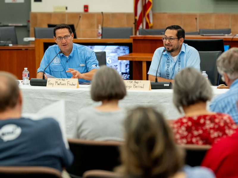 Democratic State Reps. Trey Martinez-Fischer (left) and Diego Bernal discuss the 2024-25 Texas budget Saturday during a town hall meeting at the VIA Metro Center.