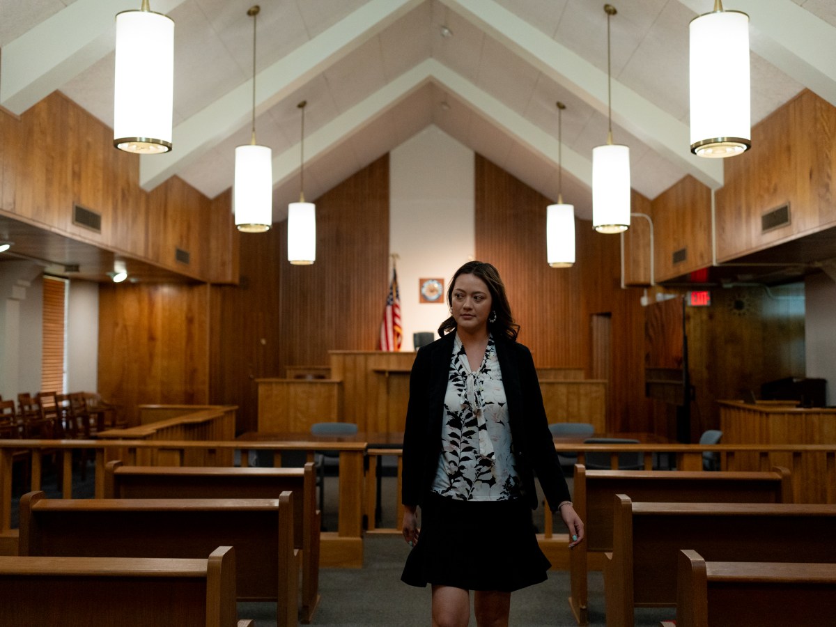 Jacqueline Calvert, staff attorney with the Housing Rights Project, walks through a courtroom inside the Center for Legal and Social Justice at St. Mary's University.