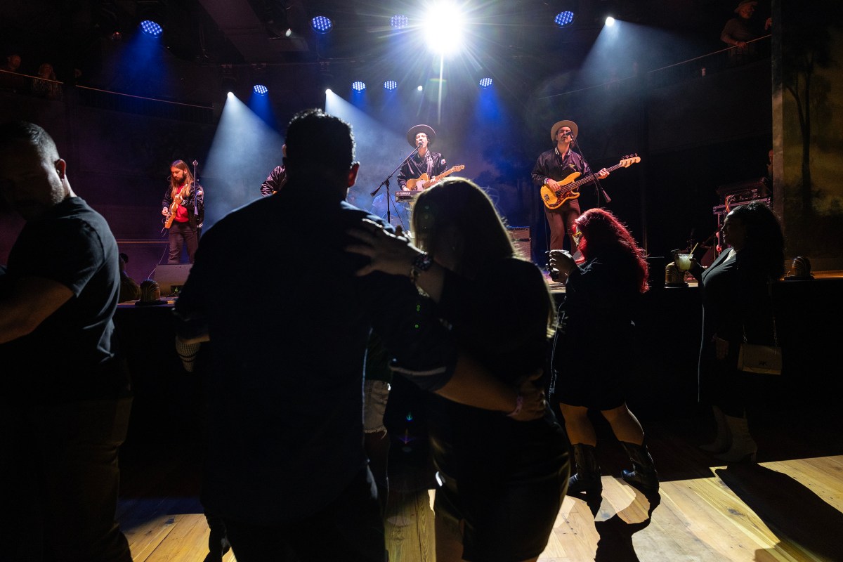 Texases keyboardist Travis Buffkin aka "Travis Texas" serenades the audience as they dance and sway on the refurbished wooden floors inside Stable Hall at the Pearl Thursday night.