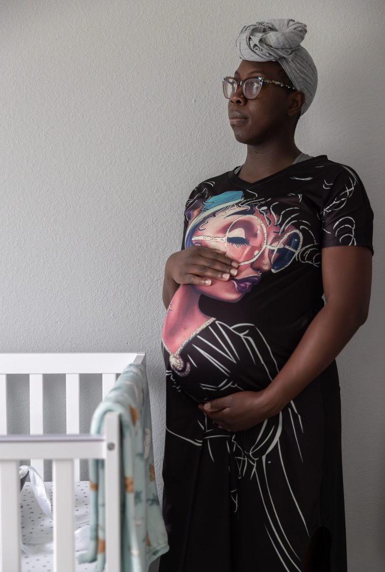 Pregnant with her first child, Head stands in her baby's nursery. After learning about alternatives to hospital births three years ago, she began planning to work with a doula and Nikki McIver-Brown, founder of San Antonio Nurse Midwife.