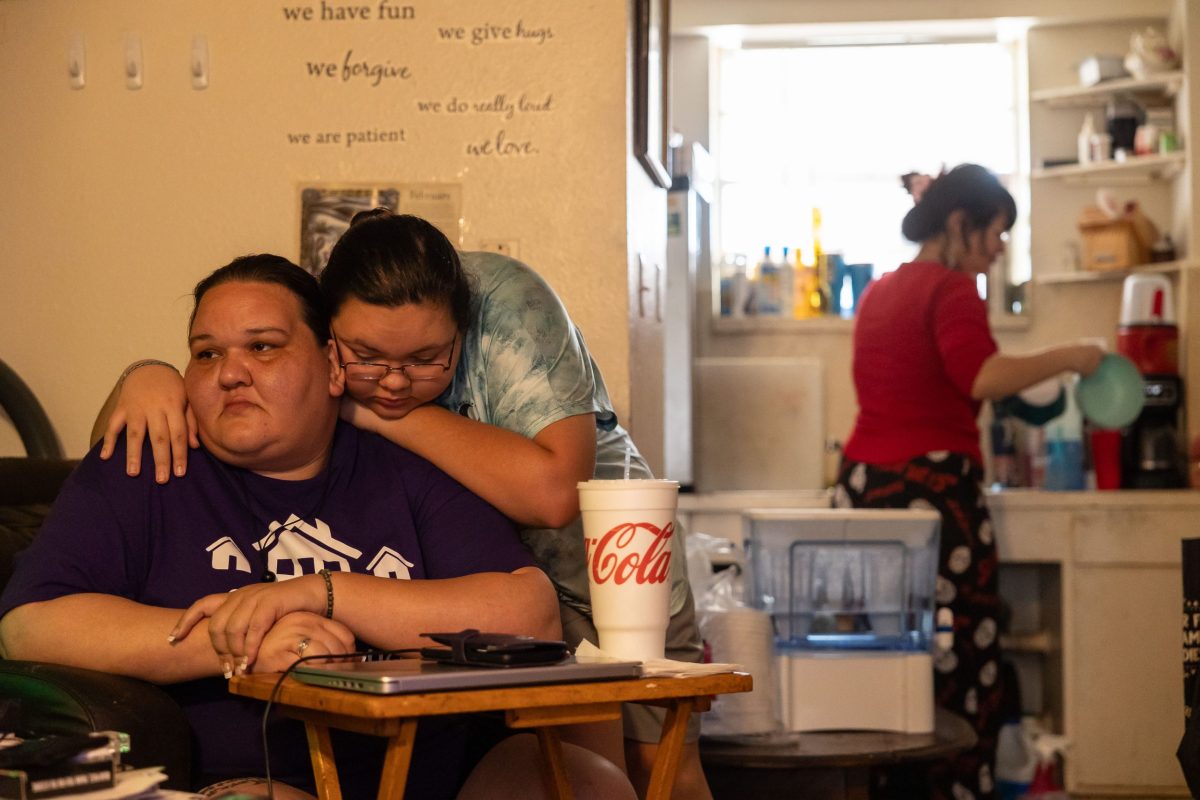 Nadia Miranda-Colgrove,19 hugs her mother Kayla Miranda in their home in the Alazán- Apache Courts Monday. The nineteen-year-old remembers getting very little sleep during the year they were homeless and struggling to complete homework from their car.