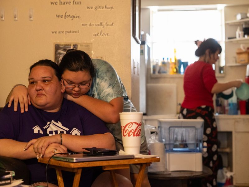 Nadia Miranda-Colgrove,19 hugs her mother Kayla Miranda in their home in the Alazán- Apache Courts Monday. The nineteen-year-old remembers getting very little sleep during the year they were homeless and struggling to complete homework from their car.