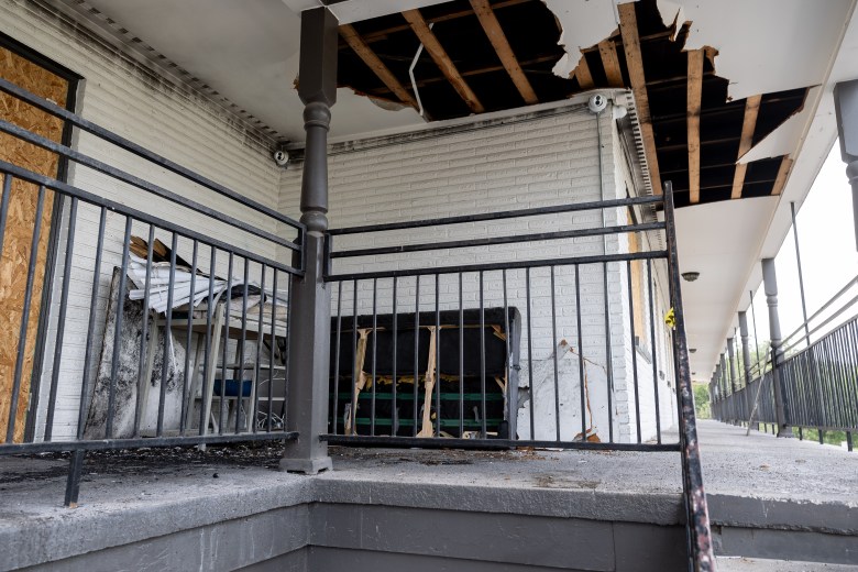 Personal items sit abandoned outside of units following a fire at The Hudson Apartments. 