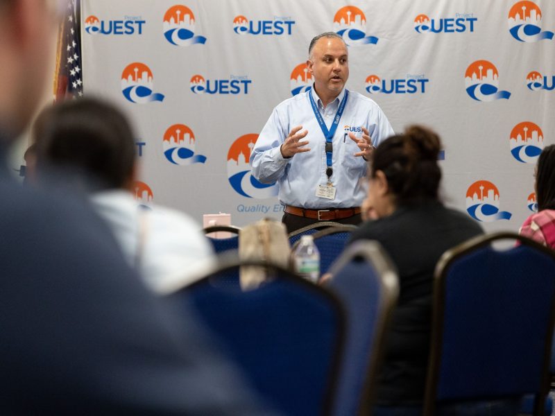 Francisco Martinez, CEO of Project Quest, addresses new participants who qualify for the Ready to Work program during an orientation Thursday.