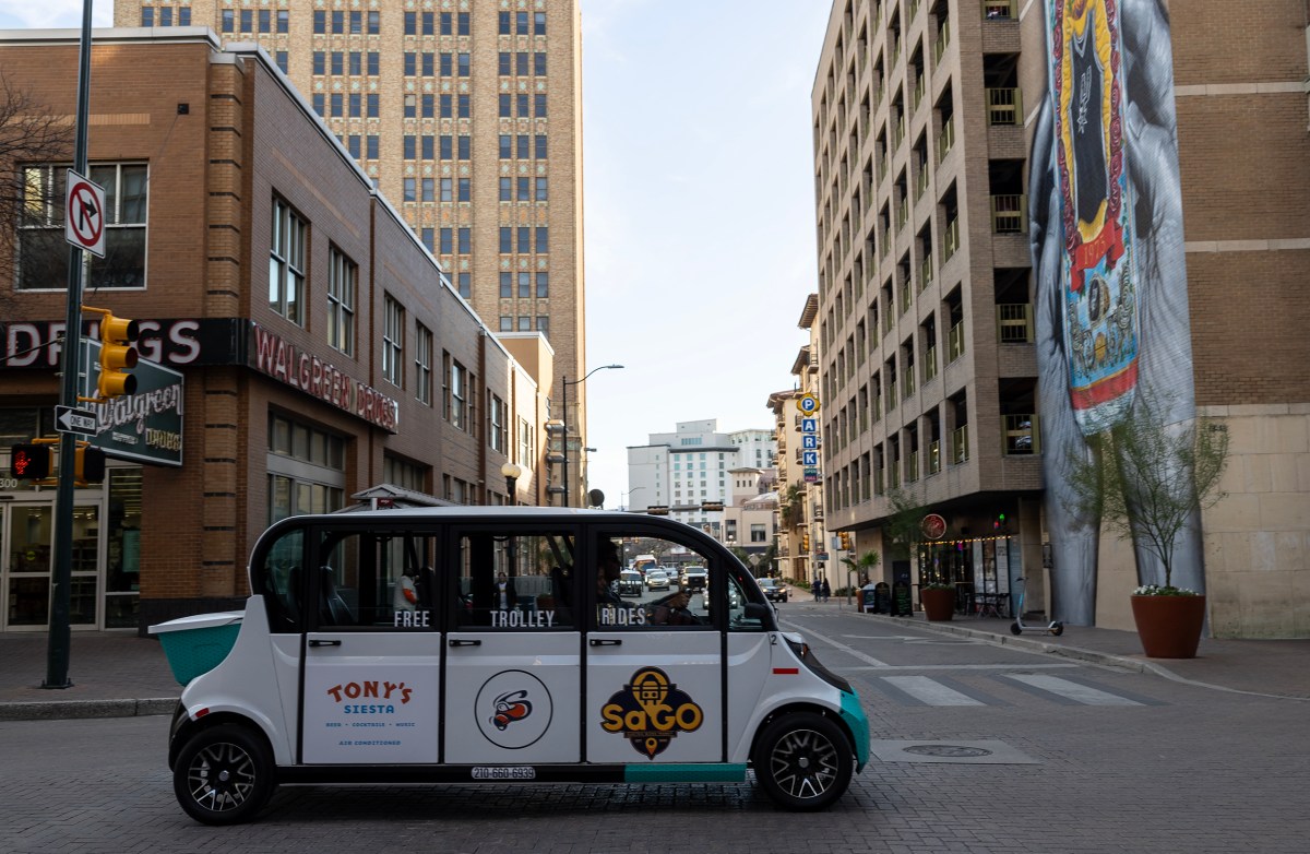 Kevin and Liz Mancha drive in one of their brand new electric trolleys downtown Wednesday. People who are interested in hopping on a free ride can book an appointment online or hail them on the street.