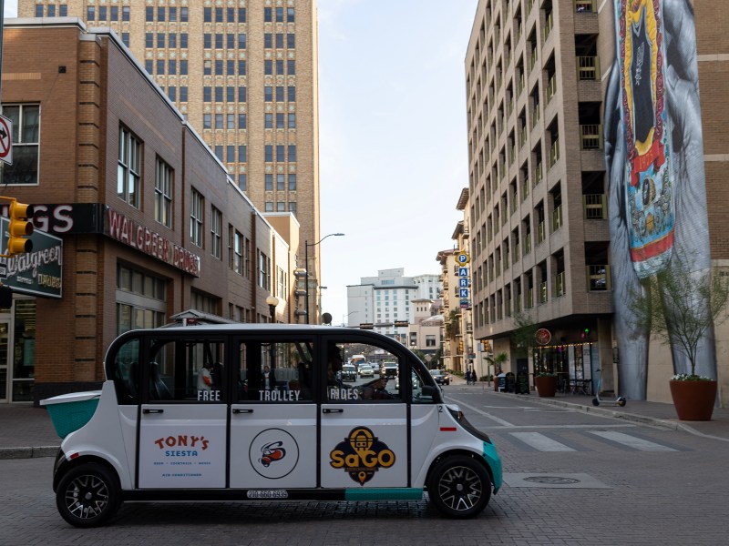 Kevin and Liz Mancha drive in one of their brand new electric trolleys downtown Wednesday. People who are interested in hopping on a free ride can book an appointment online or hail them on the street.