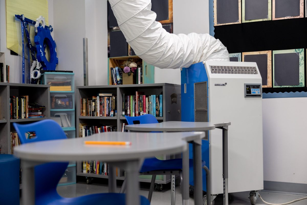 A temporary cooling system helps to regulate the temperature inside one of the classrooms at Sidney Lanier High School Friday.