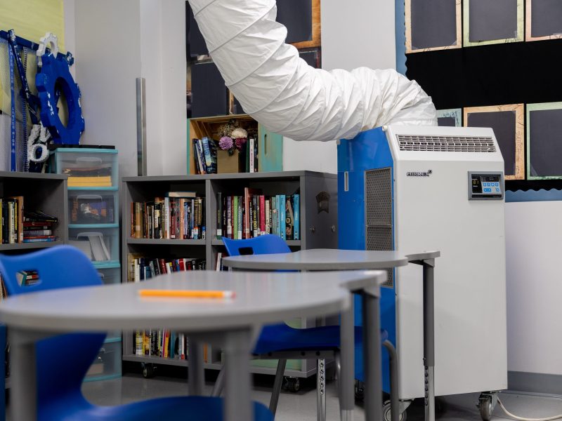 A temporary cooling system helps to regulate the temperature inside one of the classrooms at Sidney Lanier High School Friday.