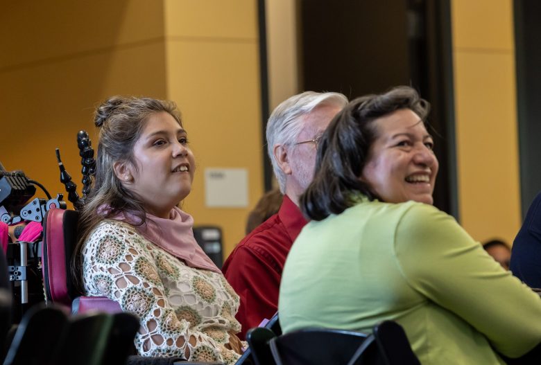 Hannah Sharman (left) and her mother Joann Sharman listen to the other students present Friday.