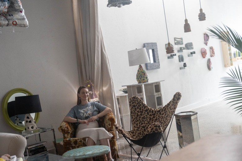 Dani Becknell relaxes in a chair that belonged to her grandmother inside of her new studio and gallery space on South Presa.