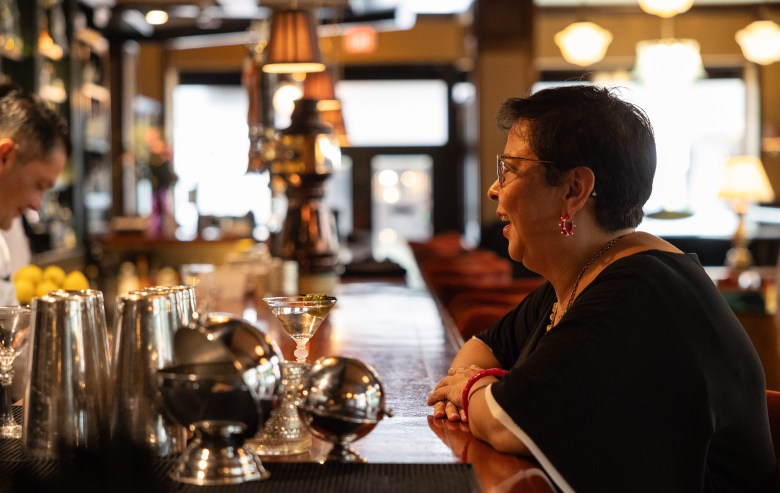 Michelle Vasquez sits in her favorite chair at Bohanan’s downtown where she makes conversation with the bartenders who know her on a first name basis.