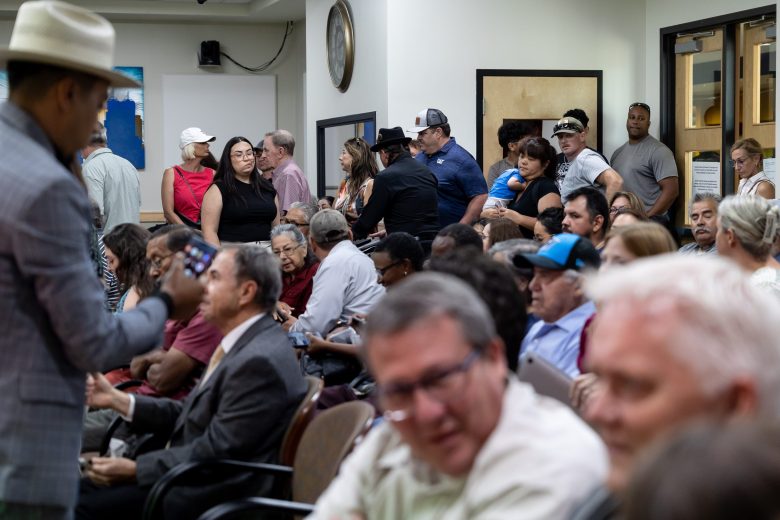 People pack the room at a Zoning Commission meeting Tuesday to speak out against the City's request for an industrial zoning overlay within two miles of Toyota plant.