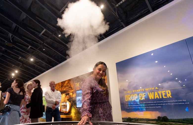 Angelica Zuniga, Education Program Coordinator with SAWS engages with the “cloud maker” at the new Edwards Aquifer Authority Education Outreach Center housed on the grounds of Morgan’s Wonderland Camp on.