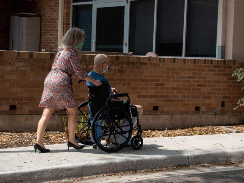 Sandy Cilone escorts her 95-year-old dad into the Morningside Manor Assisted Living facility. Both donned in masks, Sandy is the only visitor allowed in with her father. Tuesday, March 16, 2021.