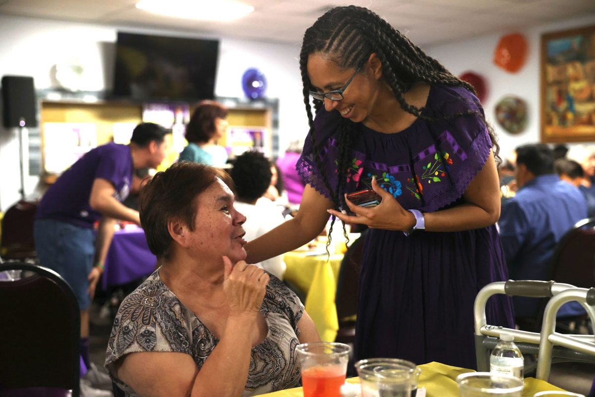 Bexar County Commissioner Rebeca Clay-Flores (Pct.3) speaks with supporters after securing victory on election night.