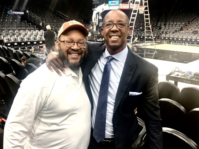 Noel and Sean Elliott embrace for a photograph at Footprint Center in Phoenix, Arizona.