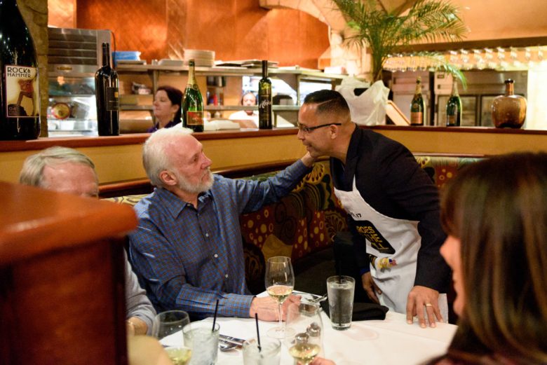 San Antonio Spurs Head Coach Gregg Popovich shares a moment with Wounded Warrior Mike Gonzales.