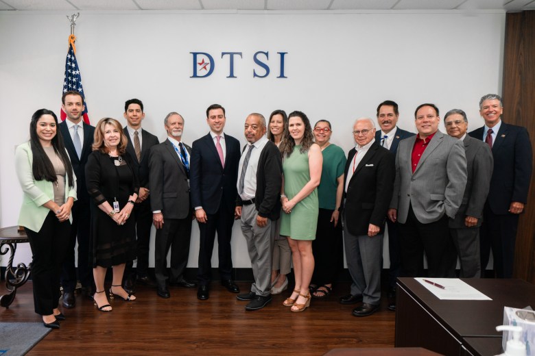 A photograph of the DTSI staff with Irys co-founders. 