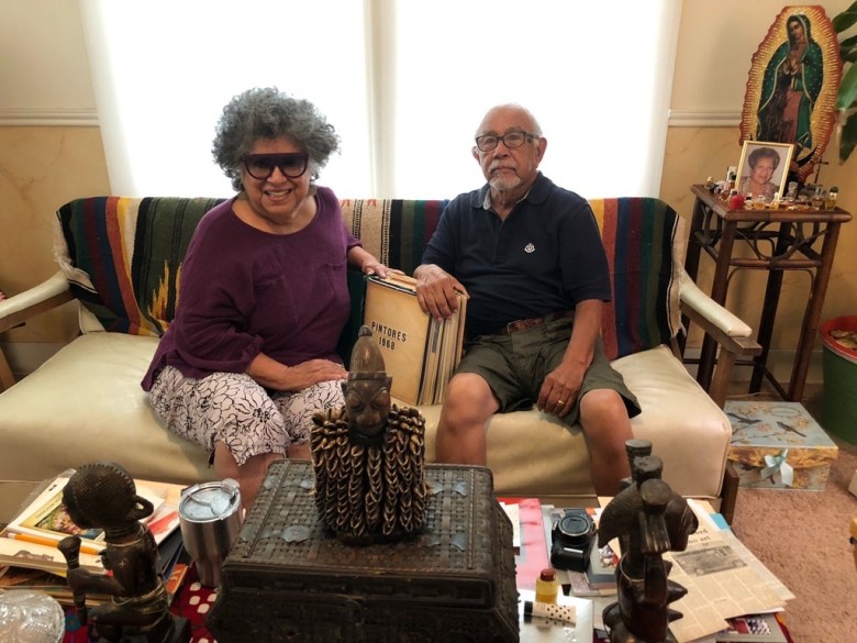 From left: former secretary for the Con Safe group, Ellen Riojas Clark sits with artist José Esquivel.