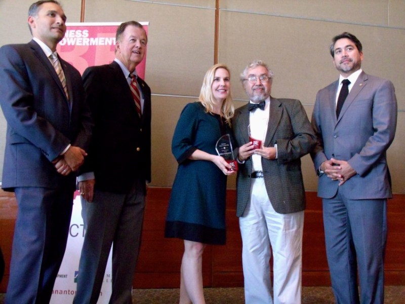 Business Empowerment (BE) San Antonio participants pose with their award during a luncheon at the San Antonio International Center on Wednesday, Oct. 28, 2015. From left are City Economic Development Director Rene Dominguez, and City Councilmembers Joe Krier (D9) and Roberto Trevino (D1). Photo by Edmond Ortiz