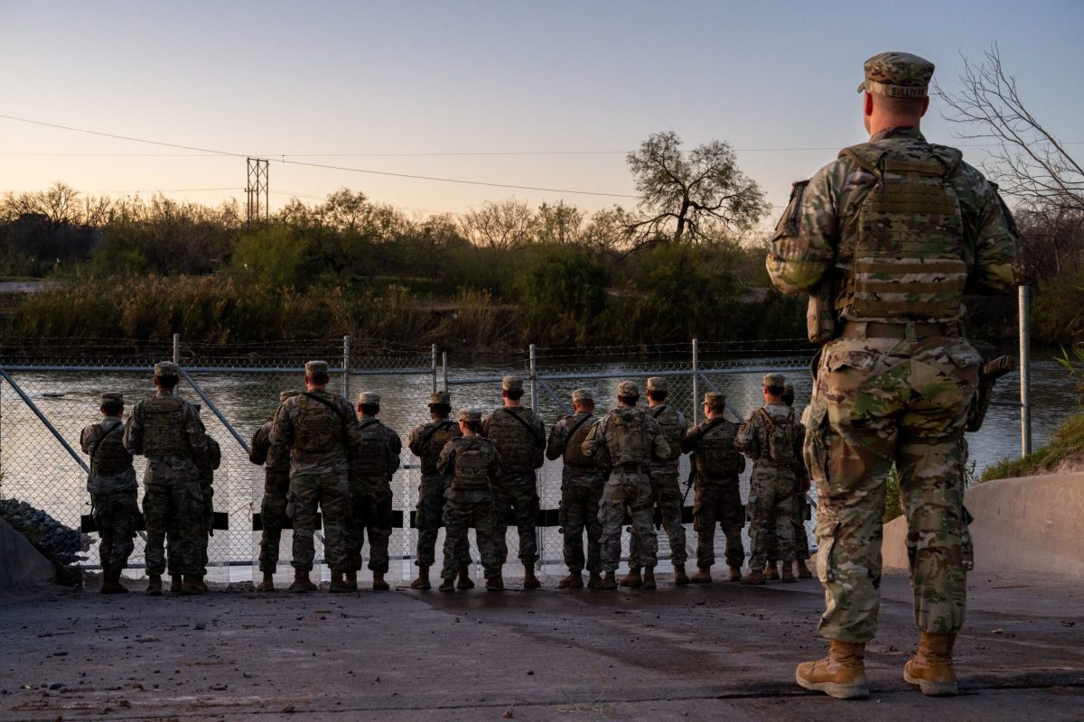 National Guard soldiers stand guard on the banks of the Rio Grande river at Shelby Park on January 12, 2024 in Eagle Pass, Texas.